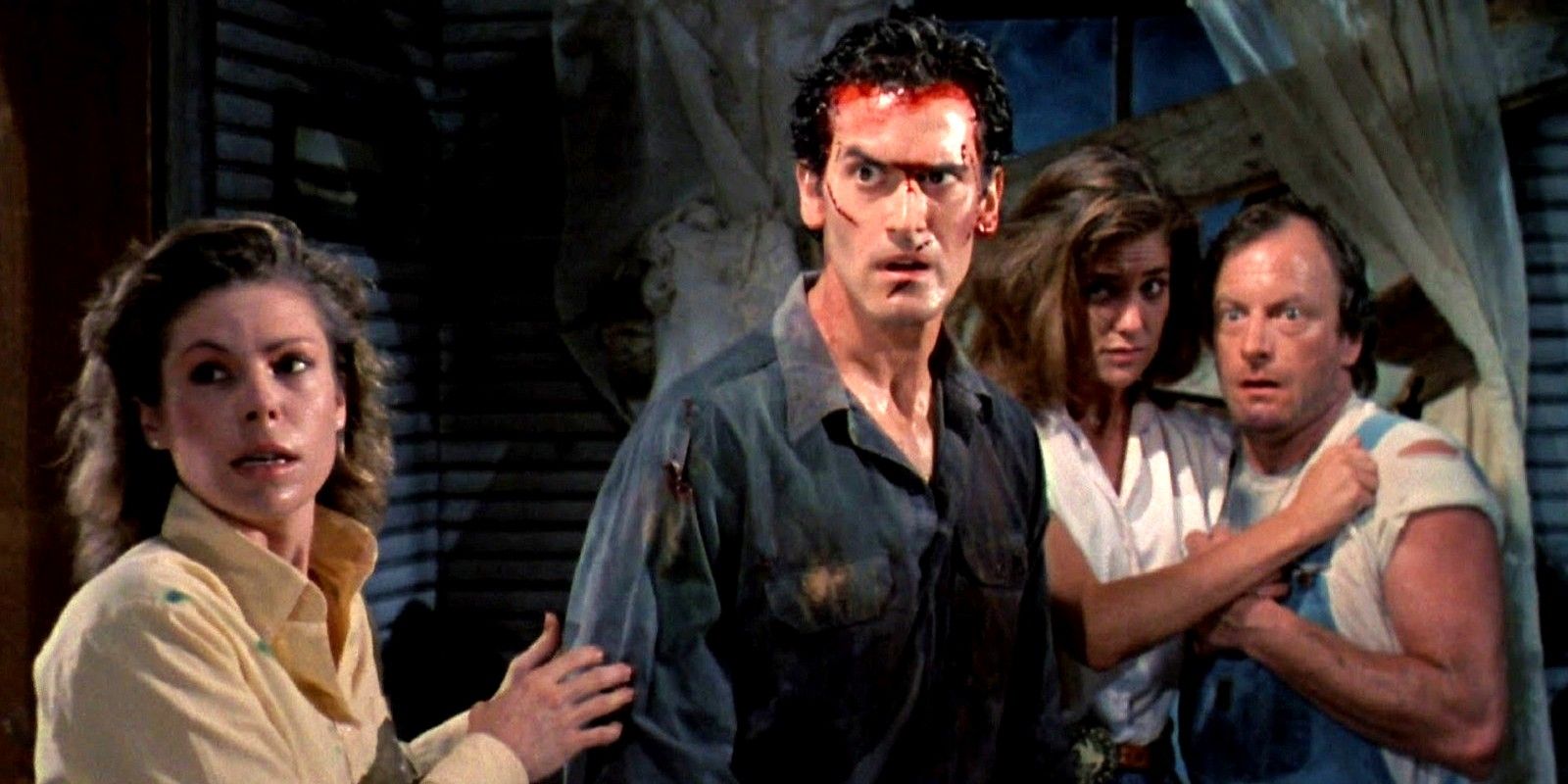 Bruce Campbell as Ash along with Annie, Jake, and Bobby in Evil Dead II