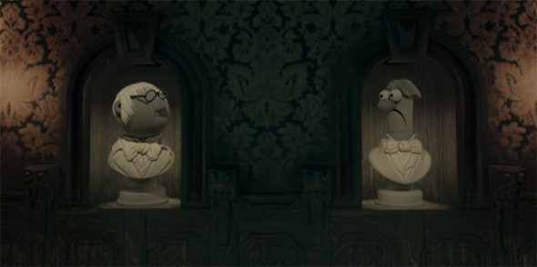 Dr. Bunsen and Beaker portraying haunted statues in the Haunted Mansion