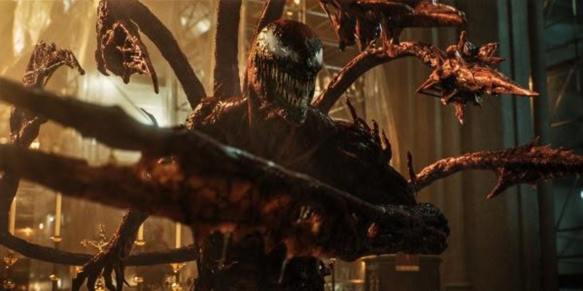 Carnage in Venom 2, releasing his tentacles and looking menacing in a church