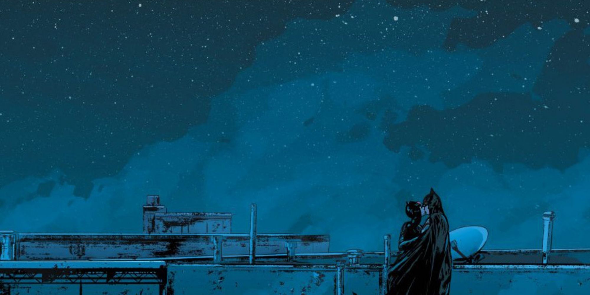 Batman and Catwoman kiss on a rooftop
