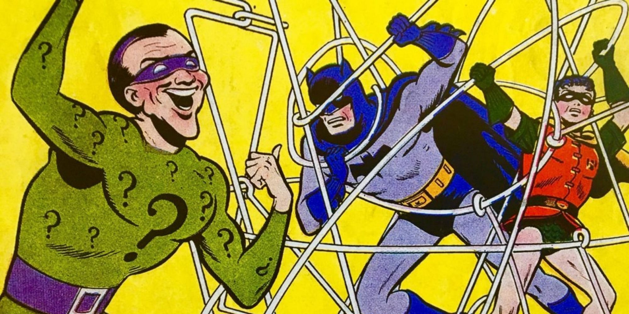 Riddler trapping Batman and Robin in a web of strings in DC comics