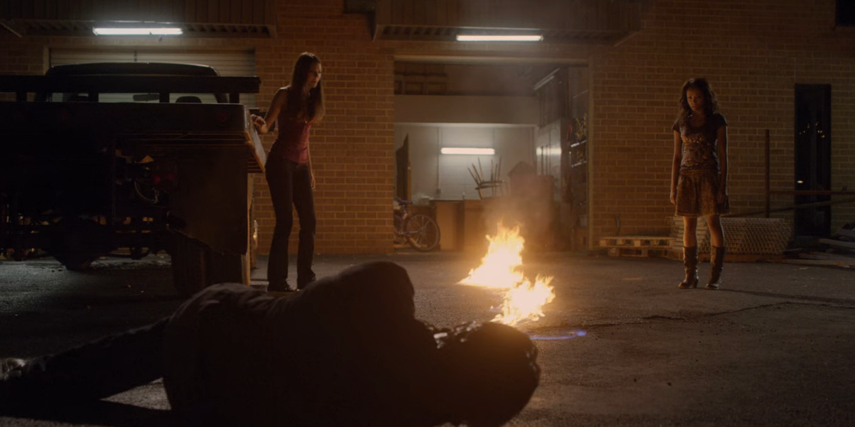 Bonnie tries to set Damon on fire in The Vampire Diaries.