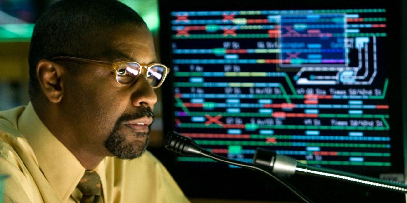 Denzel Washington next to a subway map in The Taking of Pelham 123