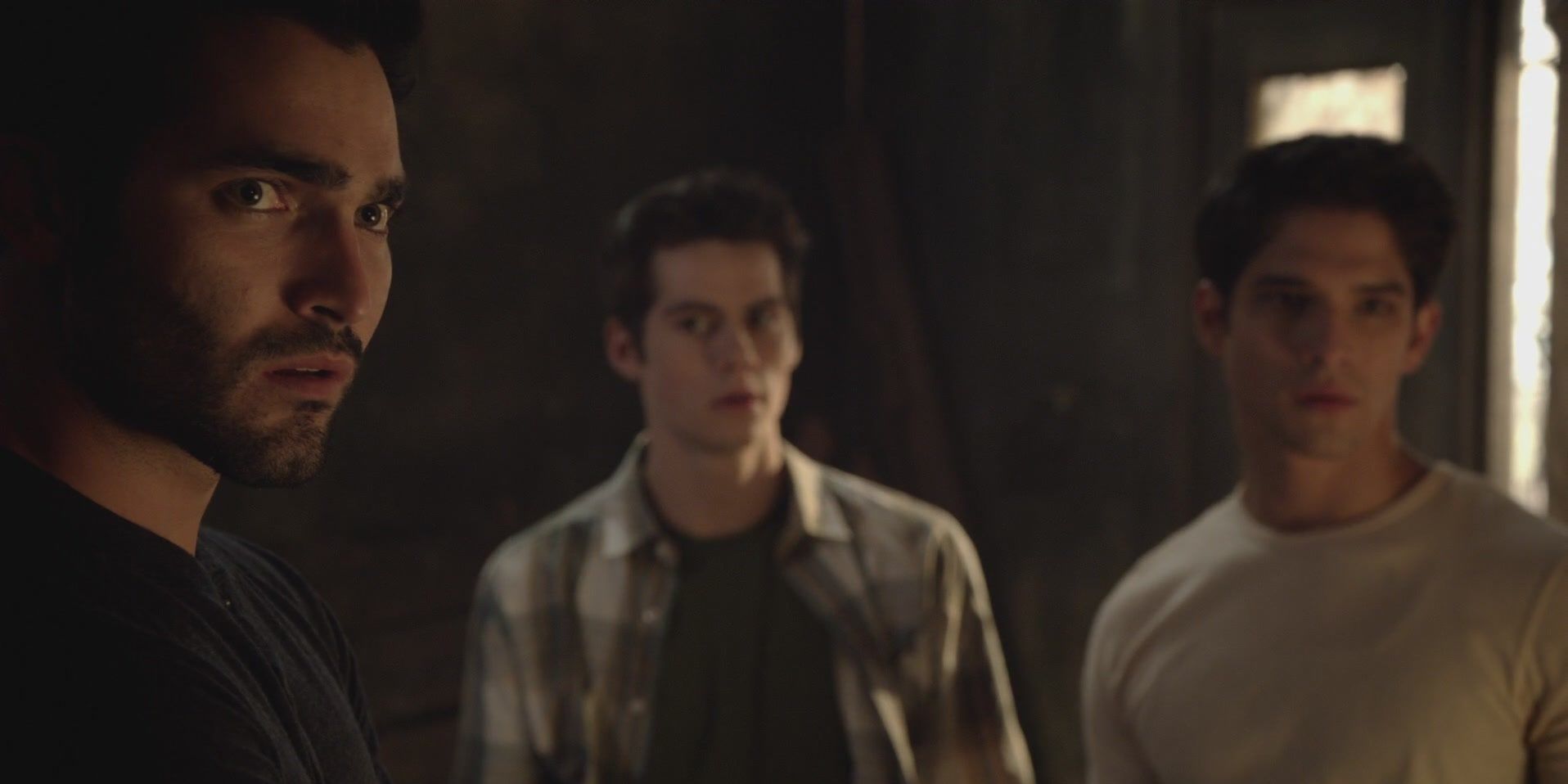 Derek standing by Scott and Stiles in Teen Wolf.