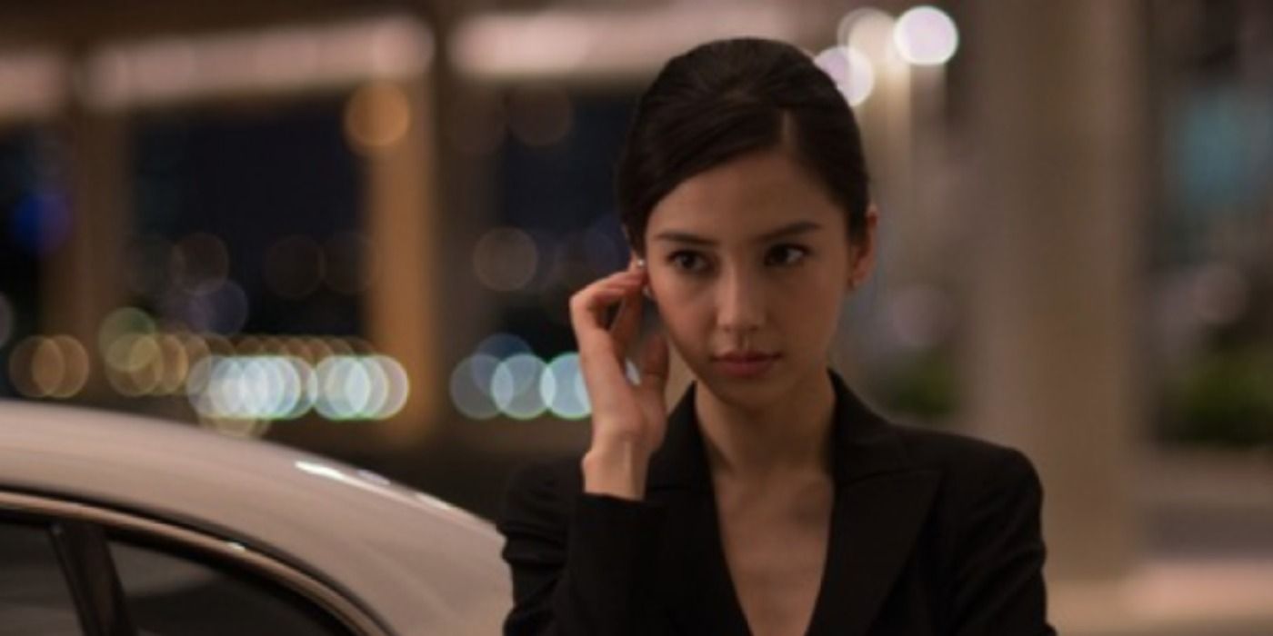 Diana Burnwood speaks into a bluetooth headset in Hitman Agent 47