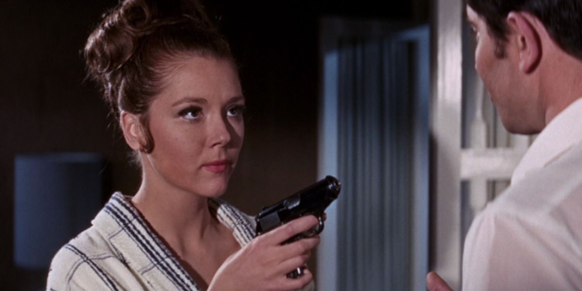 Tracy points a gun at Bond in On Her Majesty's Secret Service.