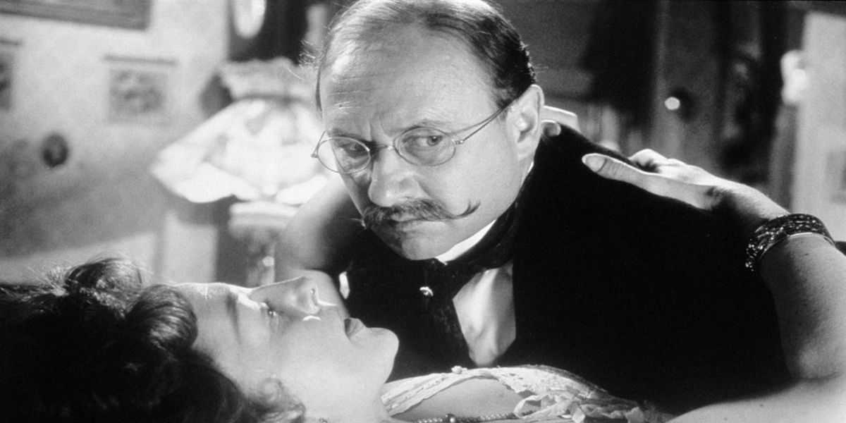 Dr. Crippen (Donald Pleasence) embracing his lover in Dr. Crippen