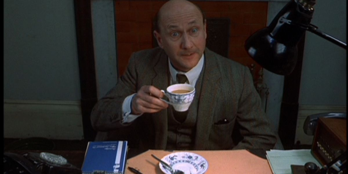 Inspector Calhoun (Donald Pleasence) enjoying his tea in Death Line
