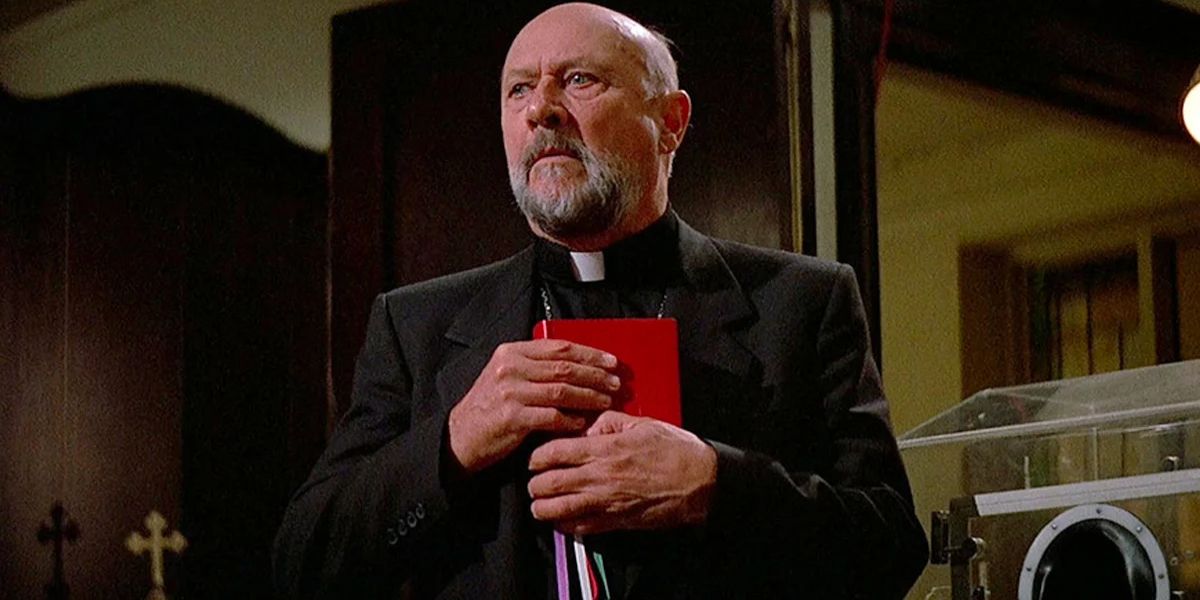The priest (Donald Pleasence) clutching his bible in Prince of Darkness