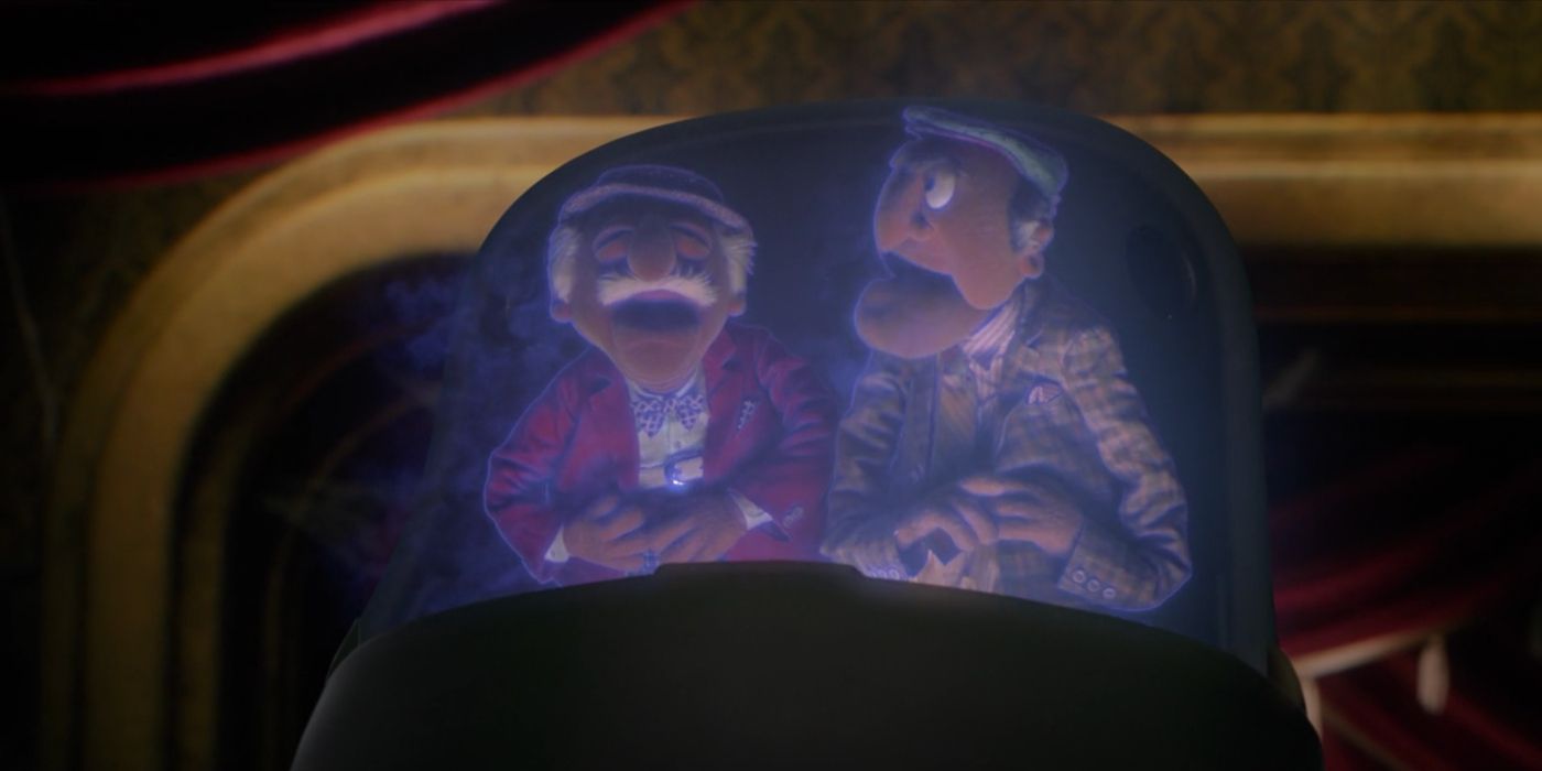 Statler and Waldorf sit in a Doom Buggy in Muppets Haunted Mansion