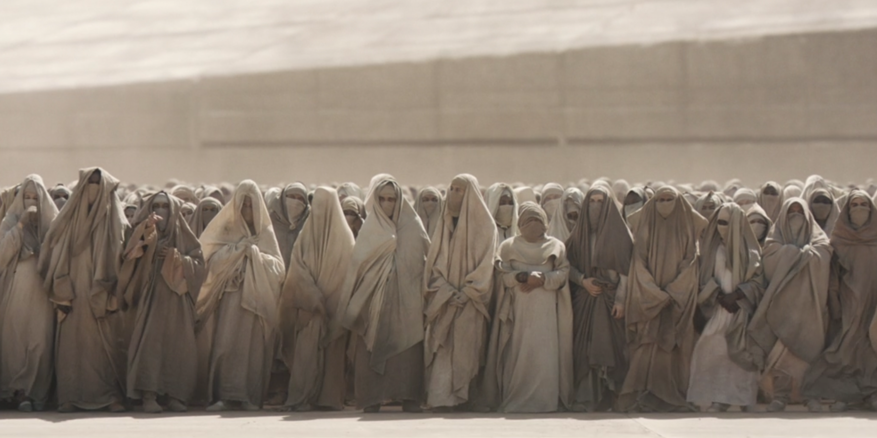 Fremen gather to welcome House Atreides to Arrakis in Dune (2021) 