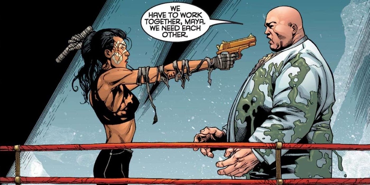 Echo holds a gun on Kingpin in Marvel comics