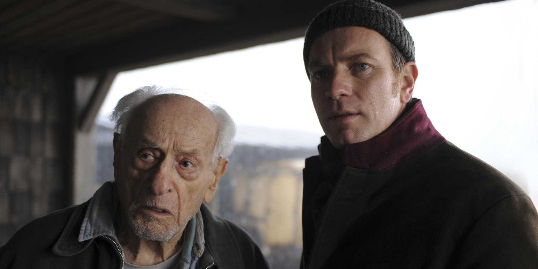 Eli Wallach and Ewan McGregor looking concerned in The Ghost Writer