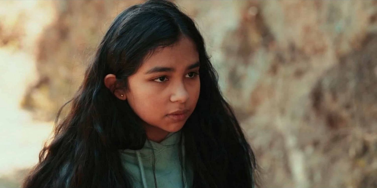 Gabby wearing a headband and talking in Mr Corman