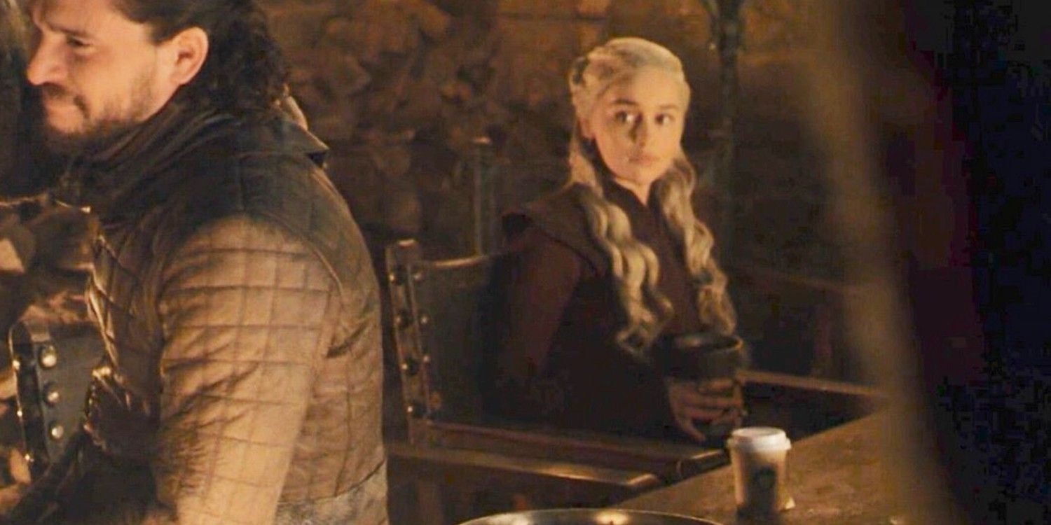 Danaerys looking at Jon Snow with a Starbucks cup on the table in Game of Thrones 