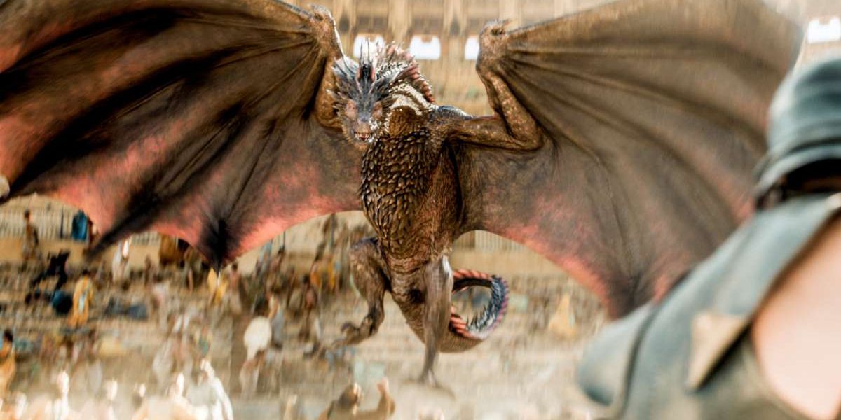 An adolescent Drogon spreads his dragon wings midair in Game of Thrones.