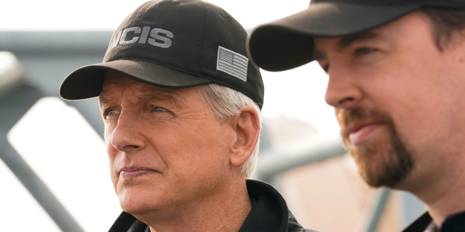 A close up of a serious Gibbs and McGee on NCIS