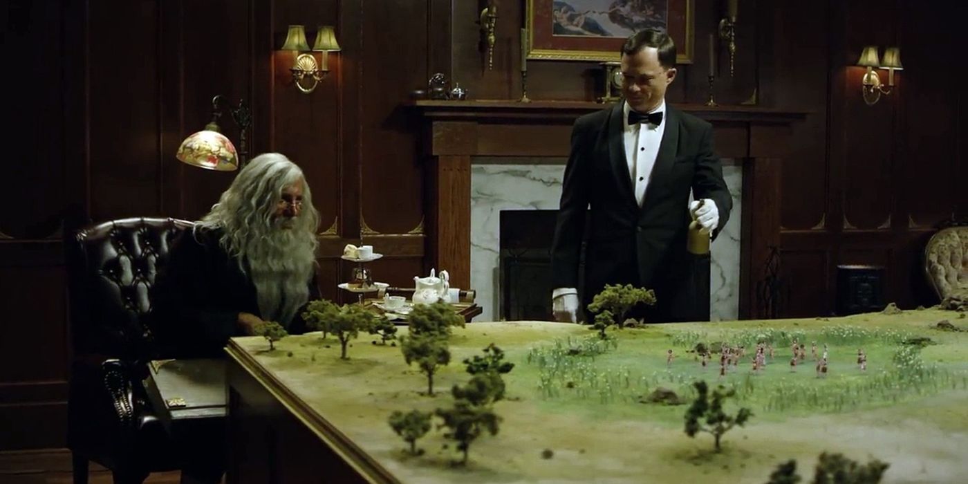 God and Geoffrey looking at the diorama-like planet in God: Serengeti by Oats Studios.