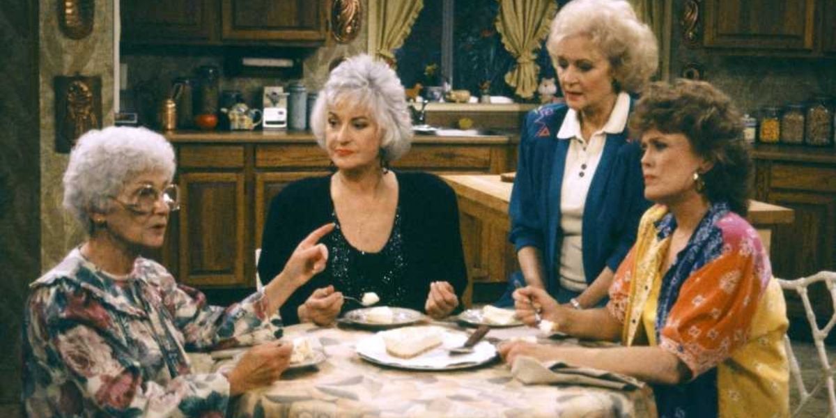 The cast of the Golden Girls reminiscing around the dining table