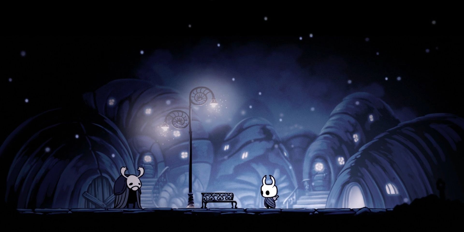 Two figures stand next to a lamp pose in a dark street in Hollow Knight.