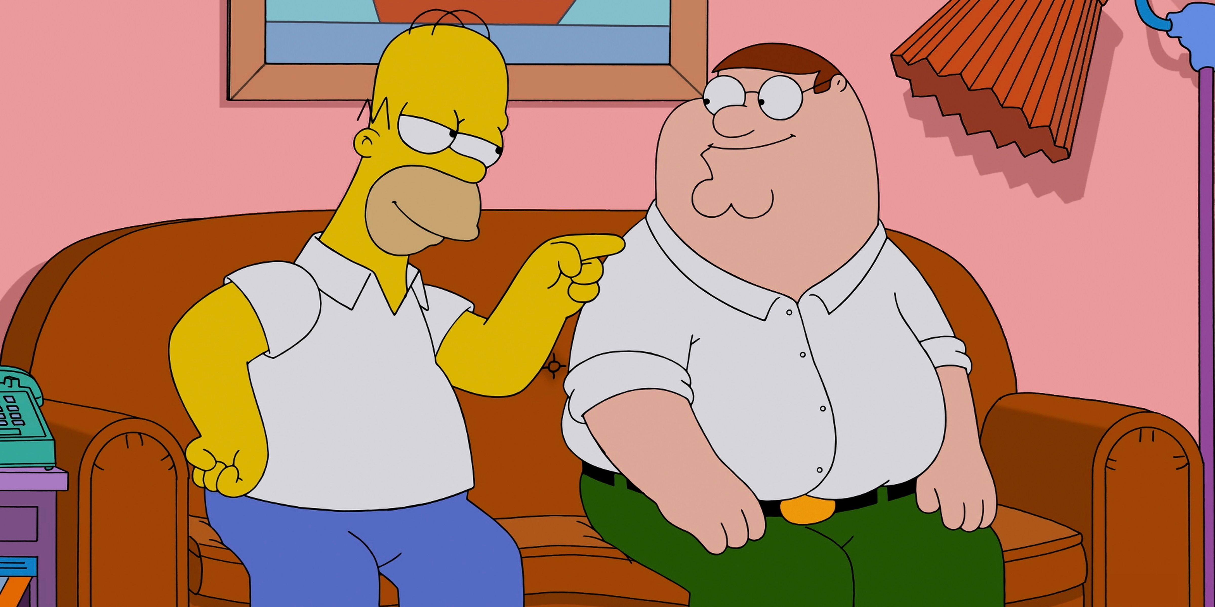 Peter Griffin sitting on the couch with Homer Simpson in Family Guy.