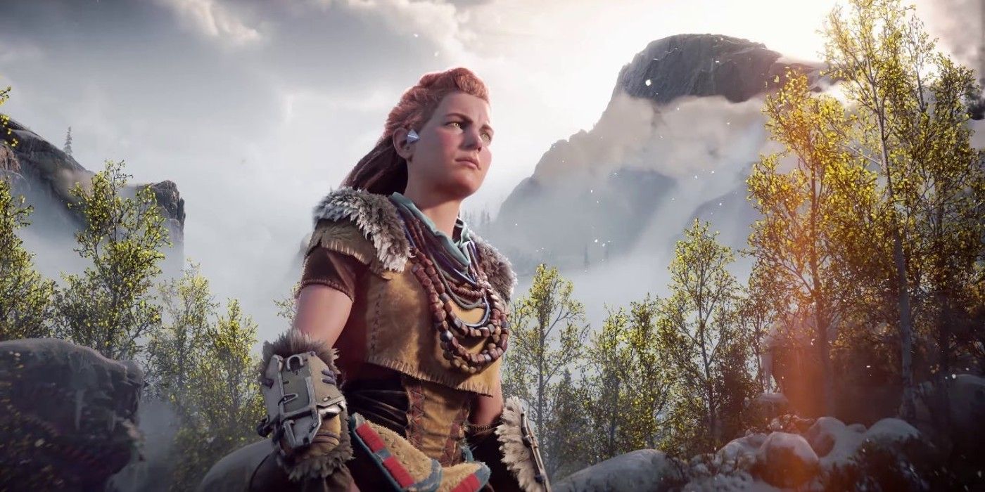 Aloy standing in the middle of a forest in Horizon Forbidden West.