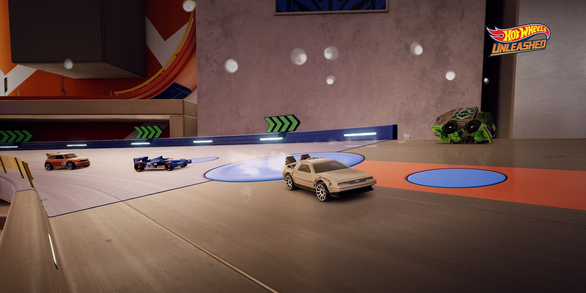 Four cars coming around a curve in Hot Wheels Unleashed