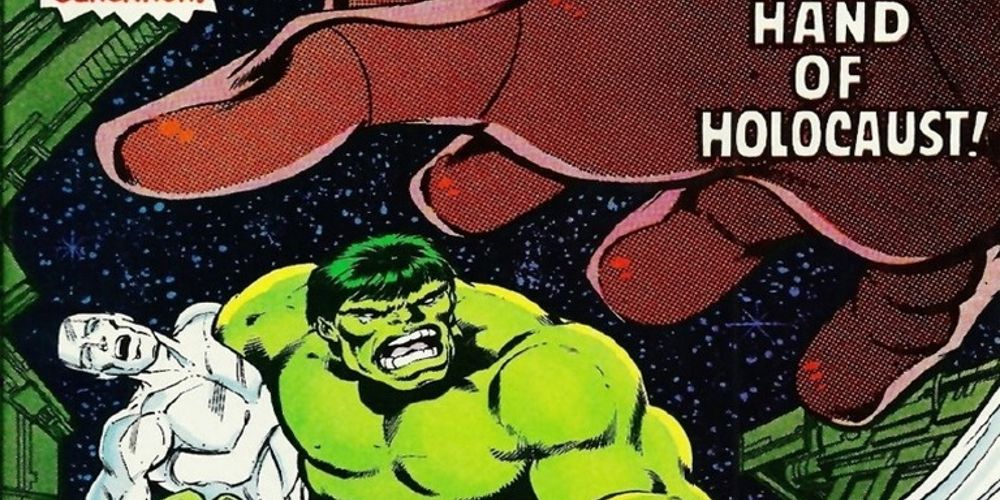 The Hulk carries the Silver Surfer as a Sentinal reaches for him.