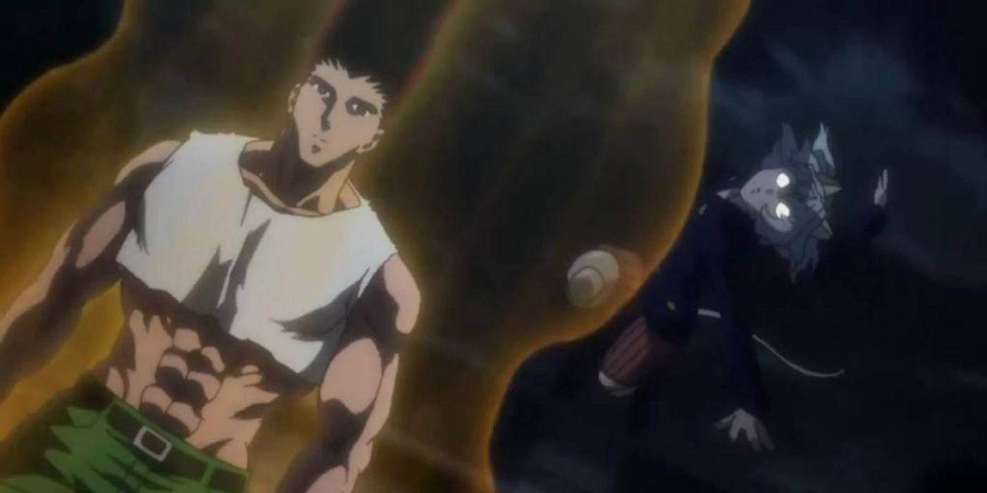 Gon surrounded by an aura while a figure floats behind him