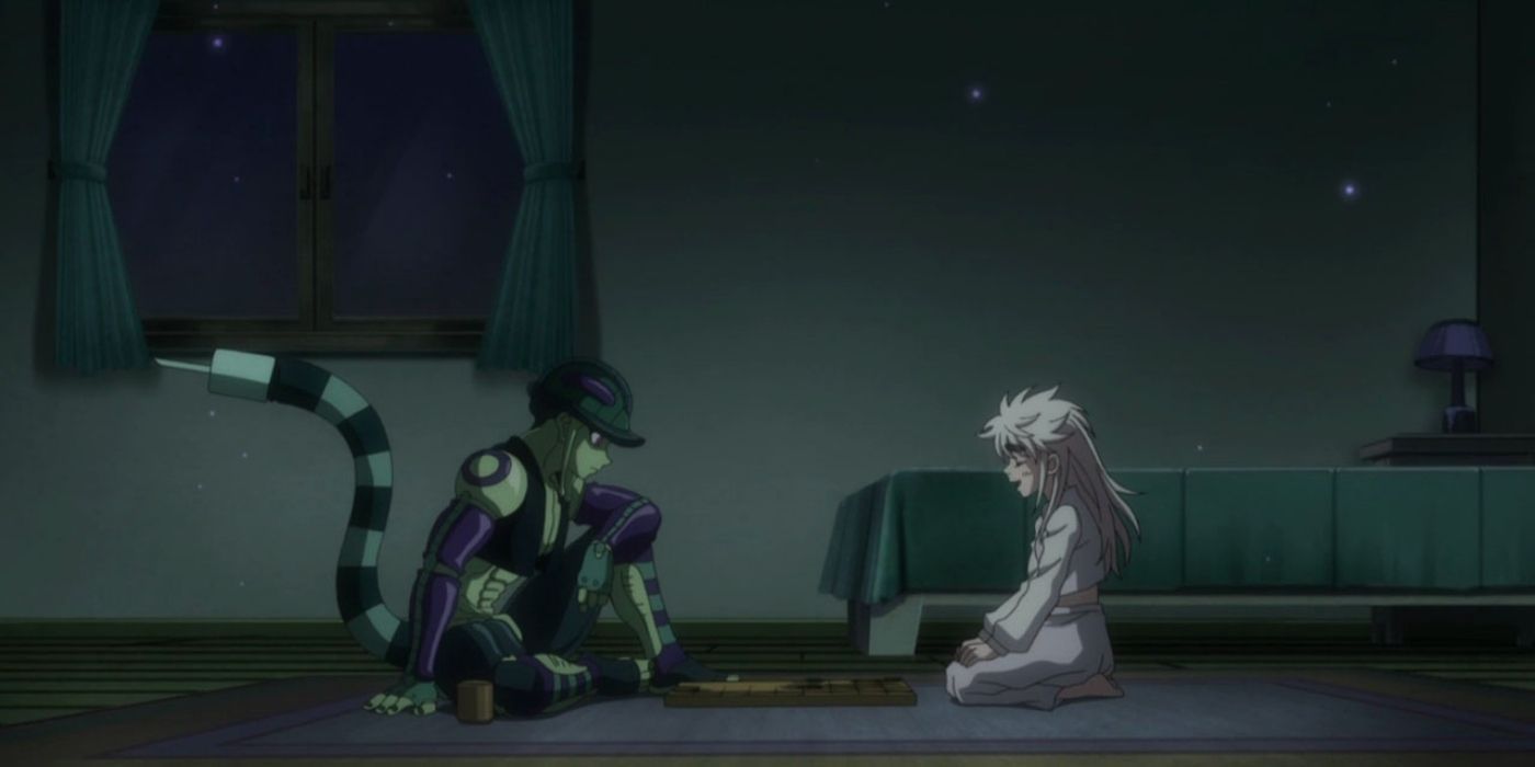 Two figures talking two each other while on the floor of a bedroom in Hunter x Hunter