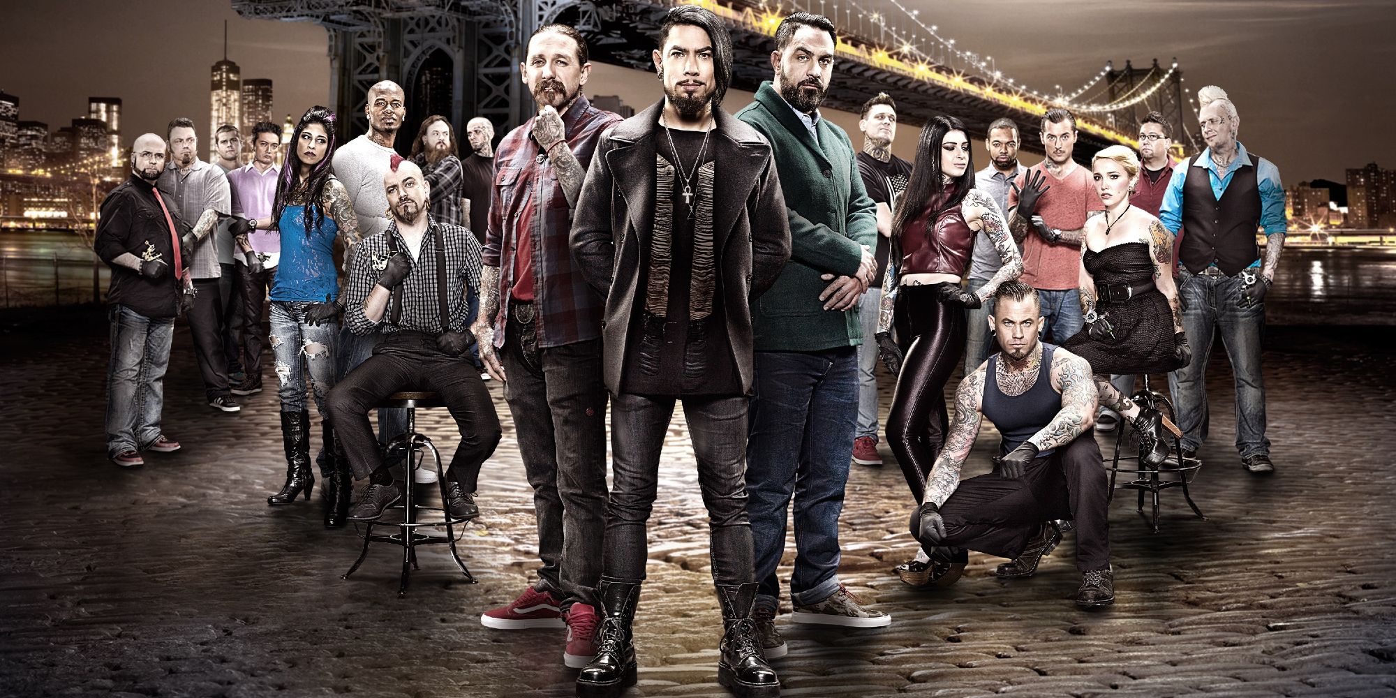 The cast of Ink Master season 4 pose in a group in front of the Brooklyn Bridge.