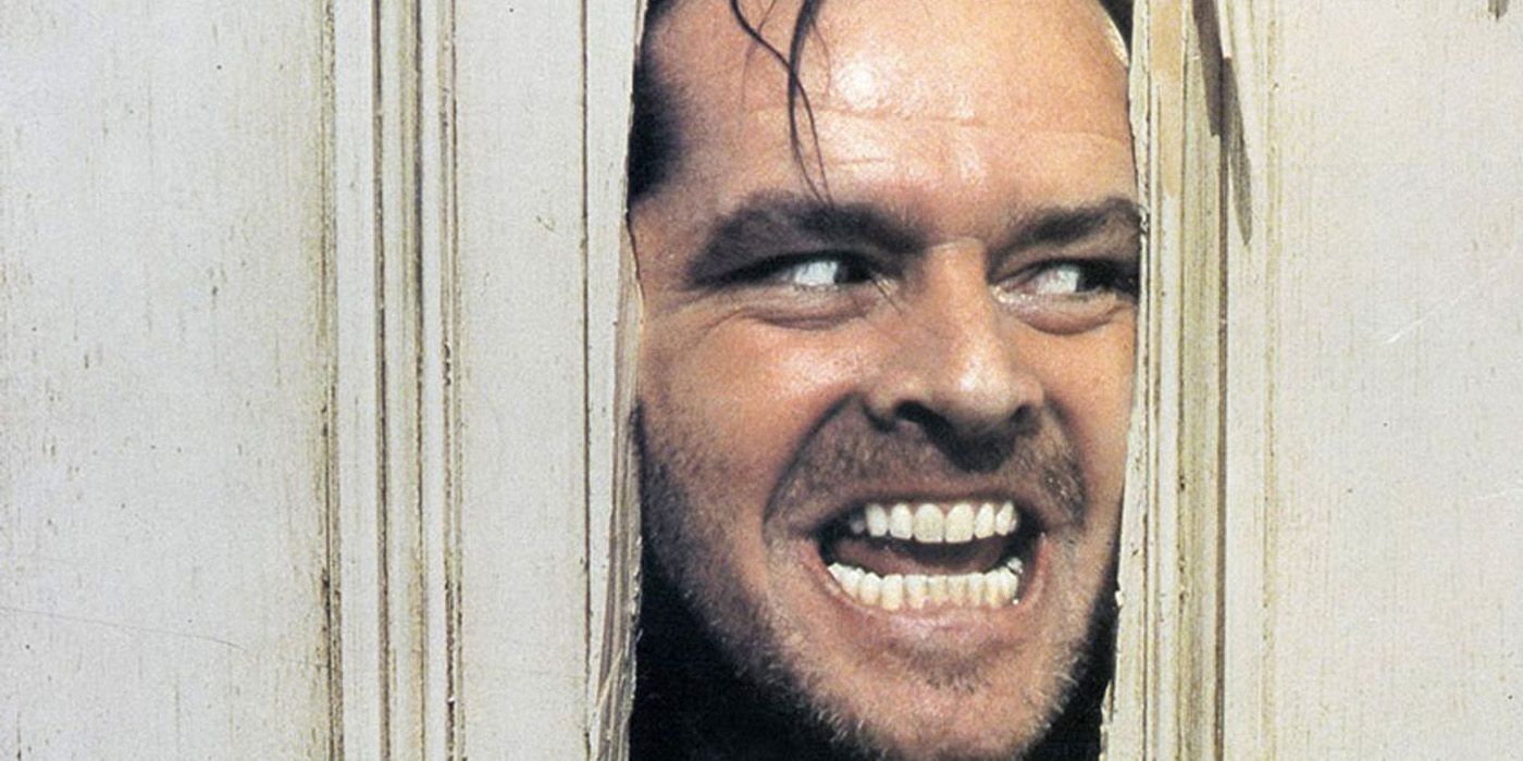 Jack Torrance looking through the door in The Shining.