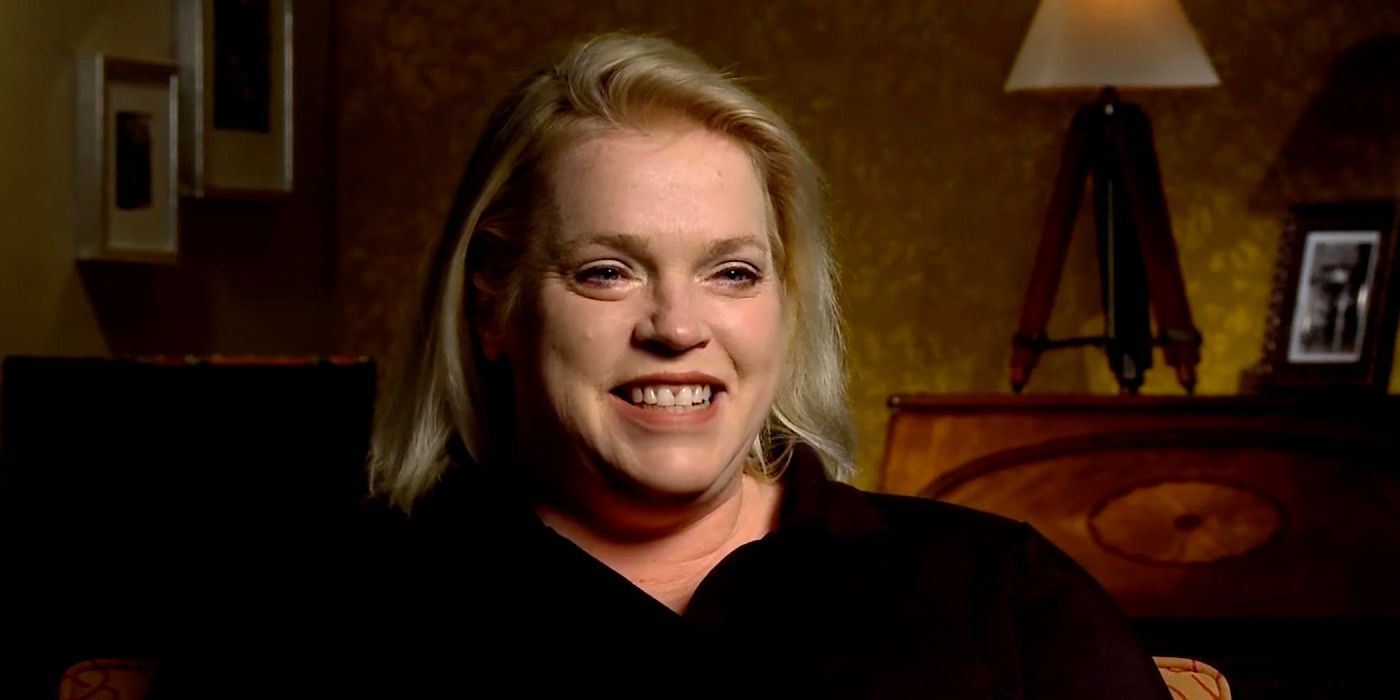 Janelle Brown of Sister Wives smiling and wearing black shirt