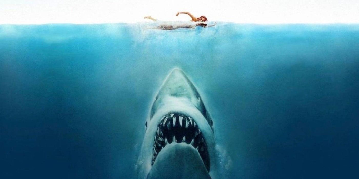 The Shark heading toward a swimmer on the poster of Jaws