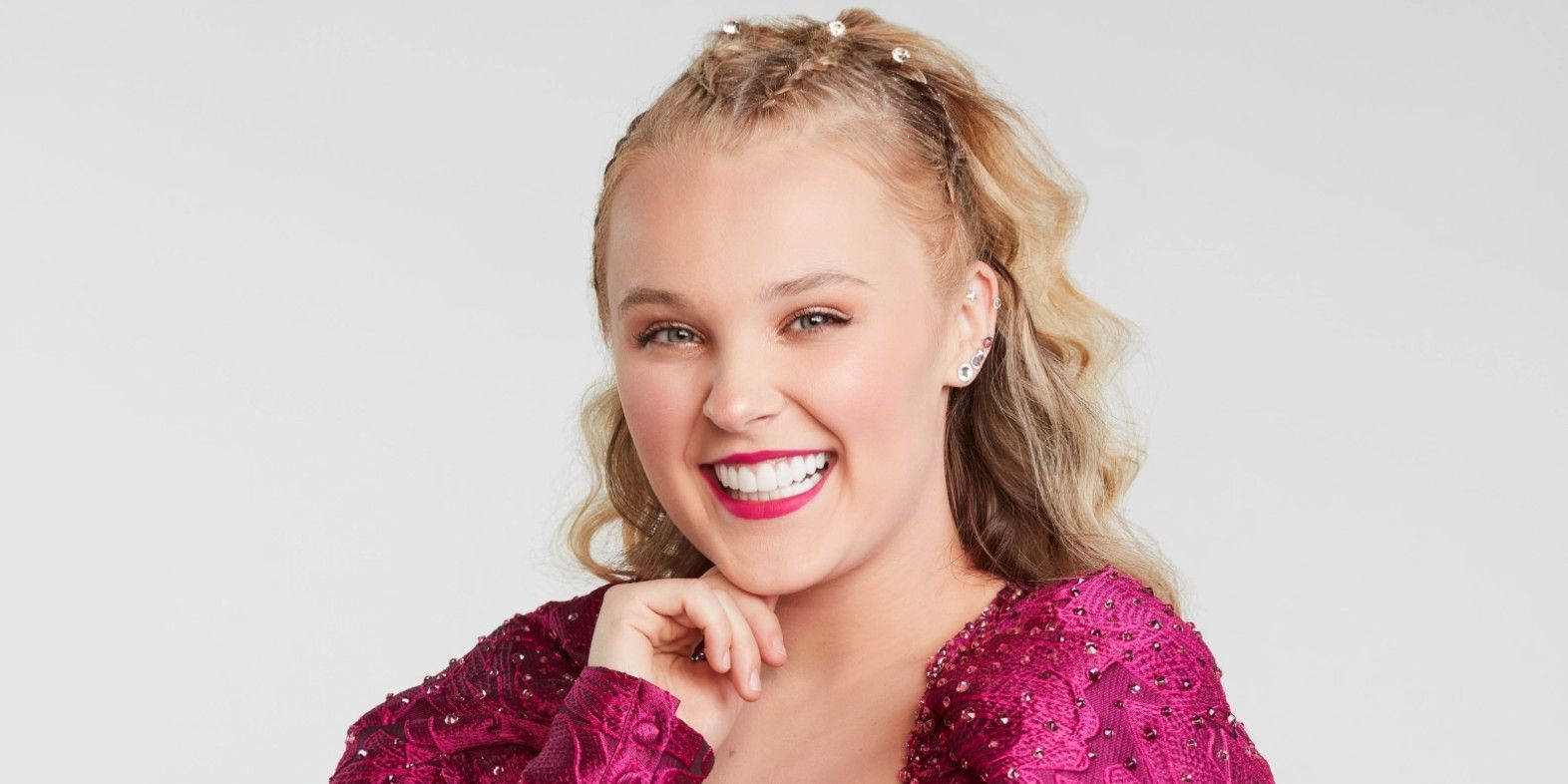 Jojo Siwa in a pink dress from the DWTS promo shoot.
