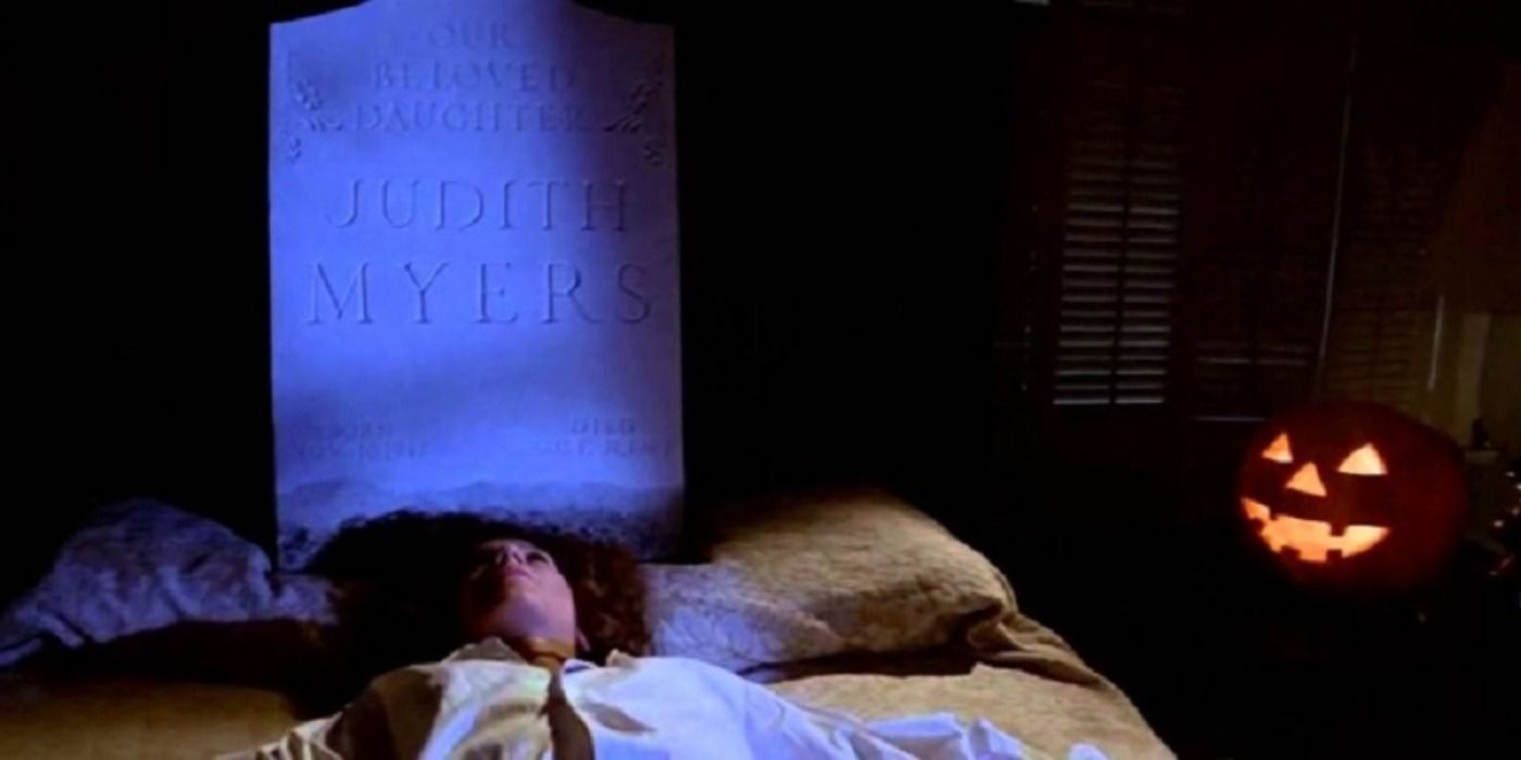 Annie laying with Michael's sister's tombstone