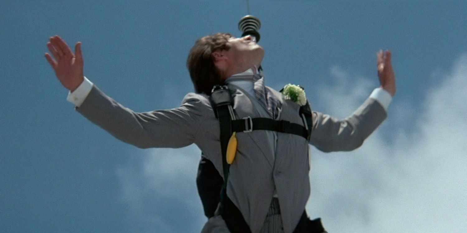 James Bond looks up as he parachutes in the sky in Licence to Kill.