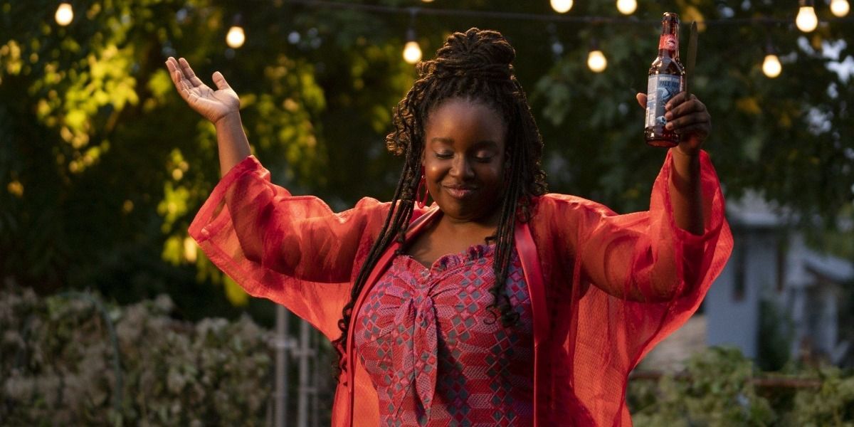 Lolly Adefope in Shrill, smiling and raising her hands up in a shrug