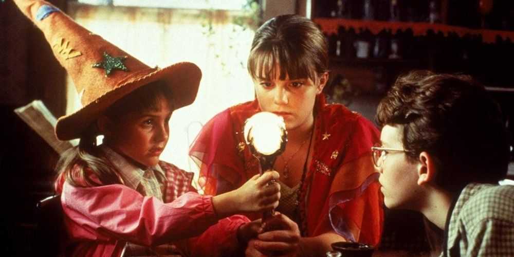 Marnie Piper in Halloweentown staring at a magic staff with a crystal ball.