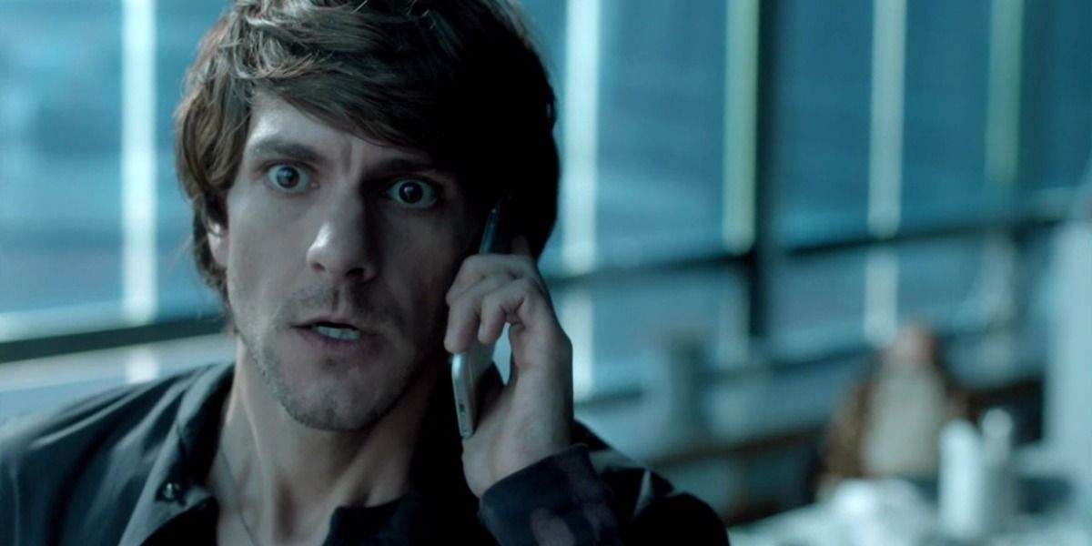 Mathew Baynton in You, Me, &amp; The Apocalypse looking scared while talking on the phone