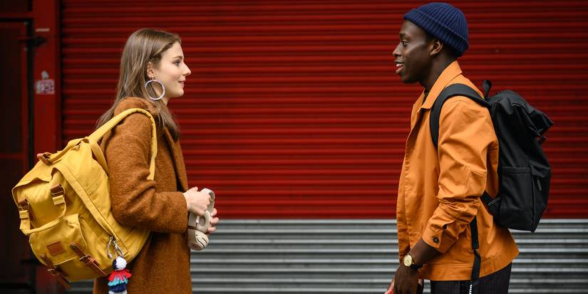 Ellie and John talking on the street in Last Night in Soho.