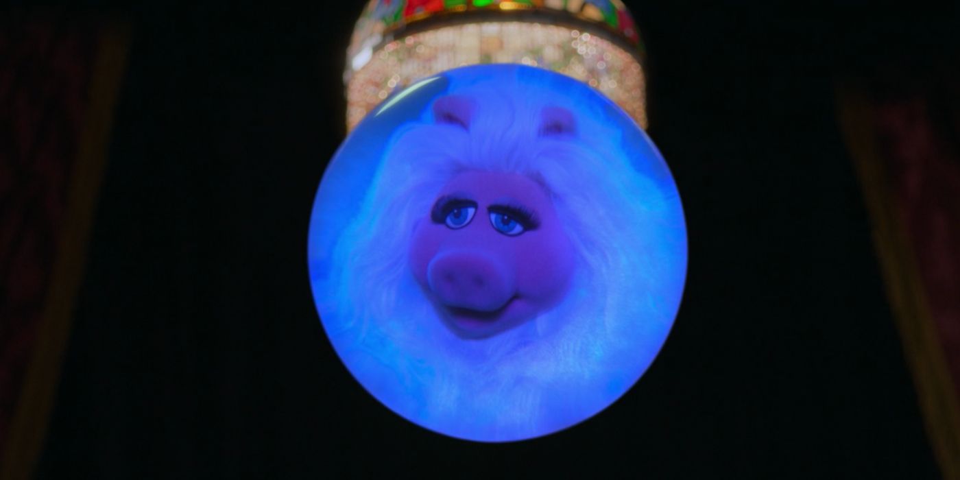 Miss Piggy floats in a crystal ball in Muppets Haunted Mansion