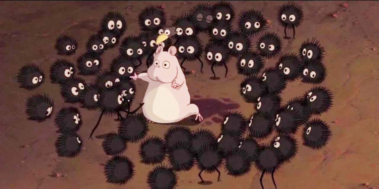 The Soot Sprites surround a mouse in Spirited Away.