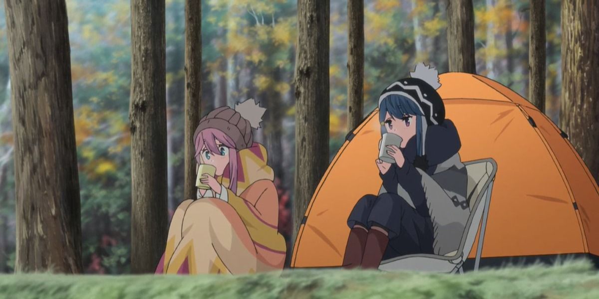 Nadeshiko and Rin from Laid Back Camp sitting by a tent and sipping tea