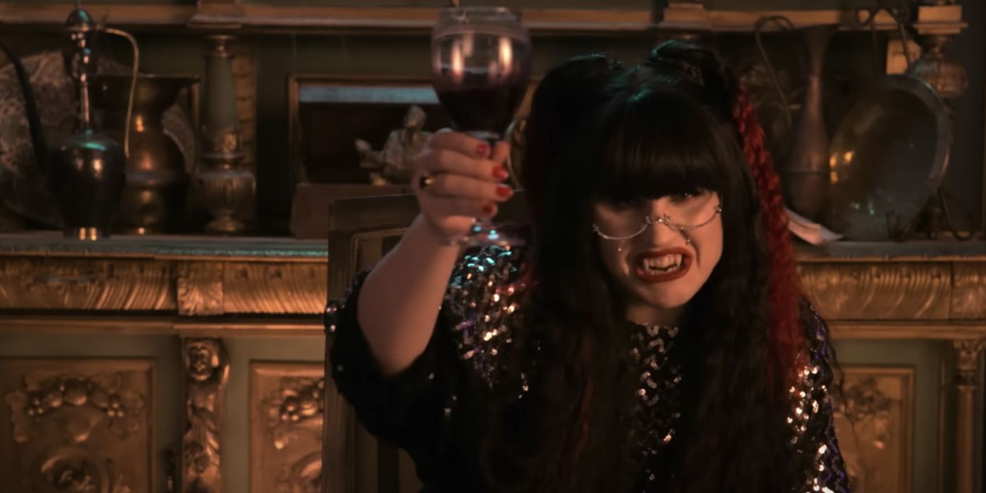 Nadja holding a wine glass in What We Do in the Shadows