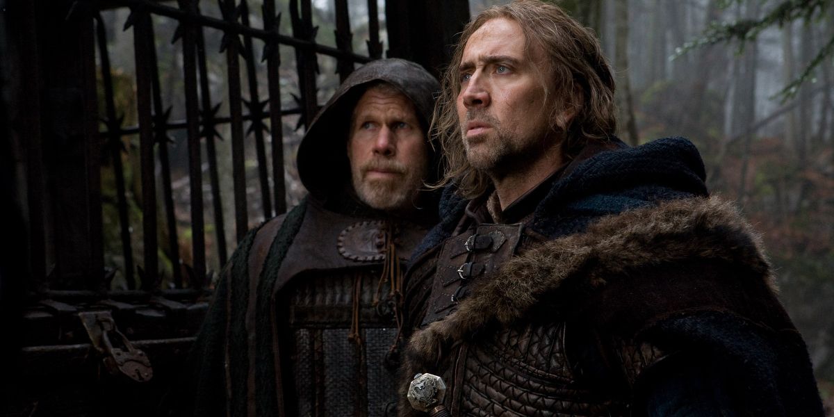 Behman (Nicolas Cage) and Felson (Ron Perlman) in front of the wooden cage in Season of the Witch