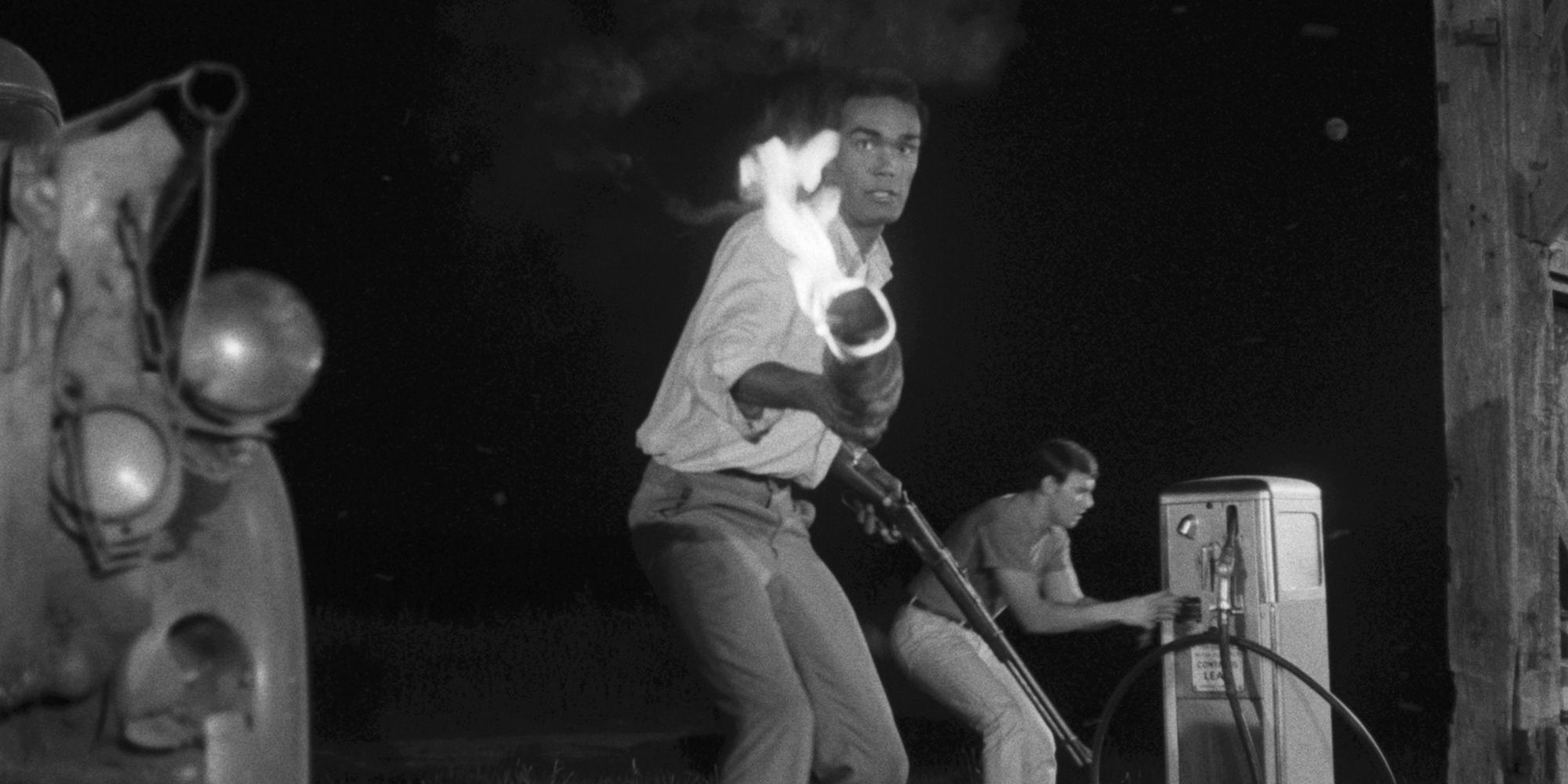 Character holding a torch in Night of the Living Dead