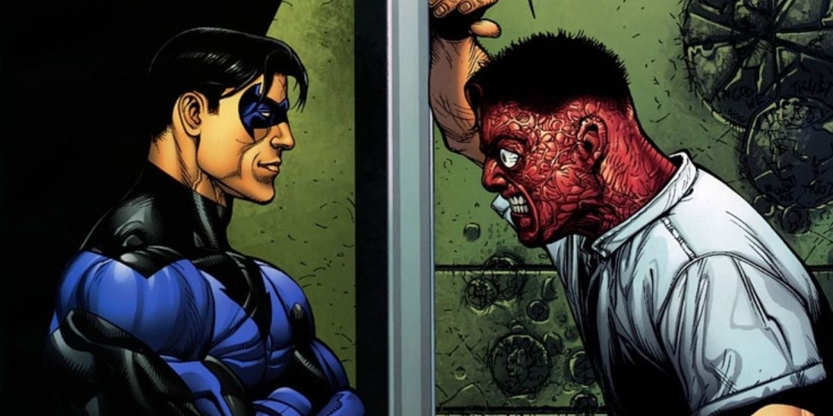 Two-Face glares at Nightwing from within his cell at Arkham.