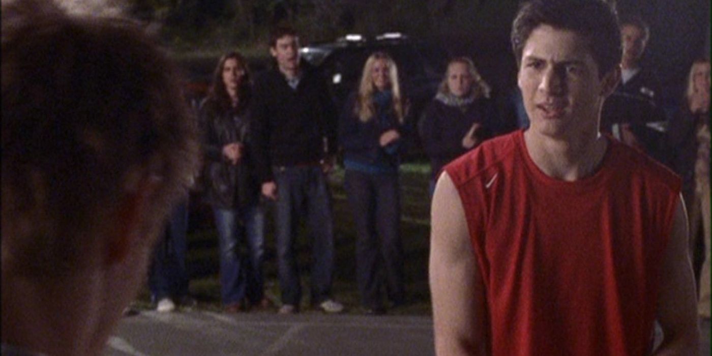 Nathan looking angry while playing a match against Lucas in One Tree Hill.