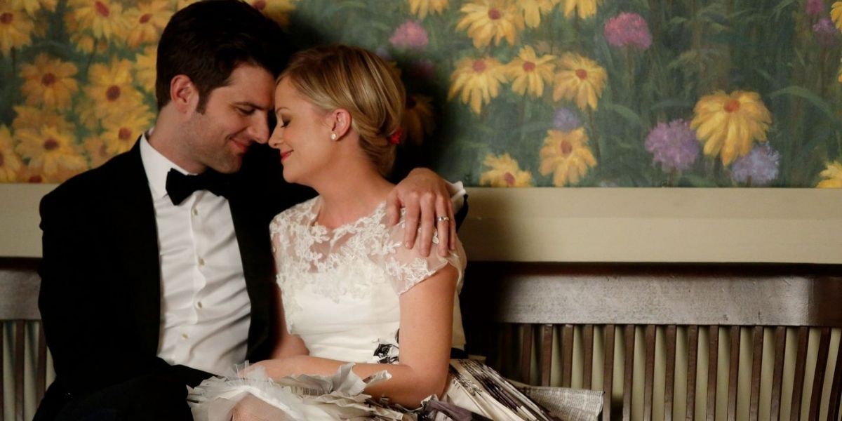 Leslie and Ben sitting together after their wedding in Parks and Rec